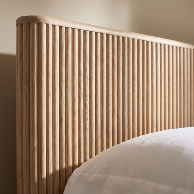 Close detail of the fluted oak headboard