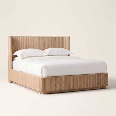 Fluted oak platform bed frame with white bedding