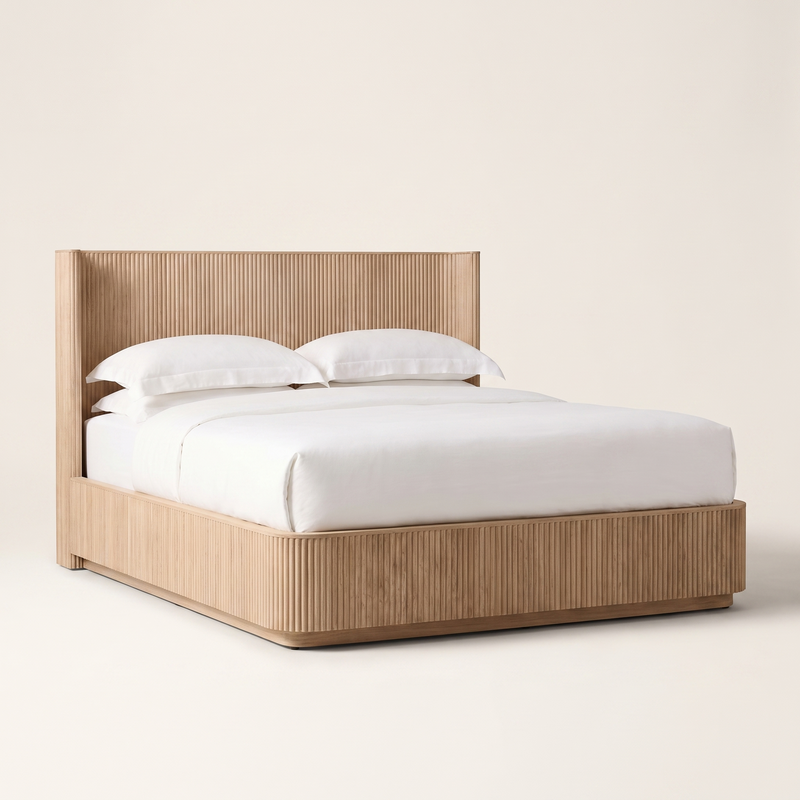 Fluted oak platform bed frame with white bedding