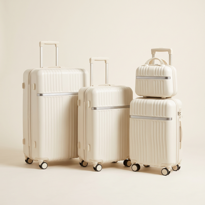Four-piece cream hardshell luggage set