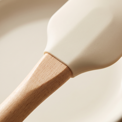 Detail where cream silicone meets the oak handle