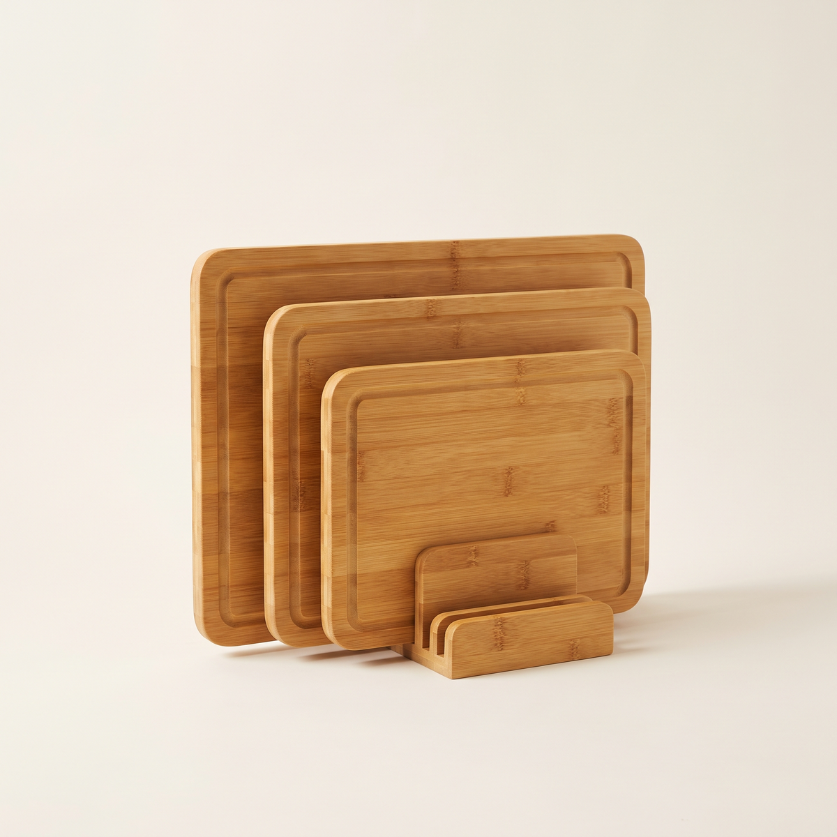 Four-piece bamboo chopping board set with stand