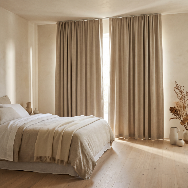 Oatmeal linen blackout curtains in a bedroom