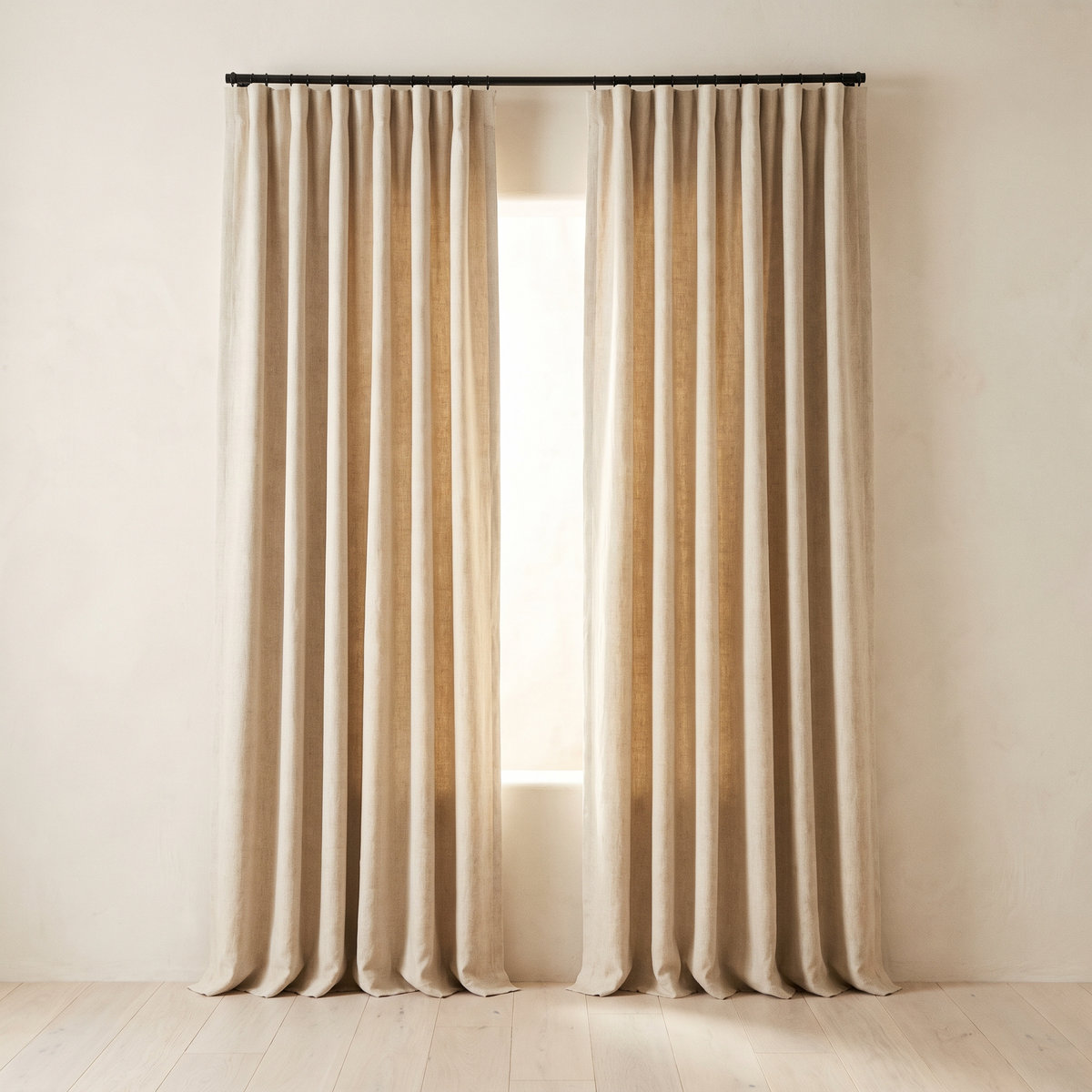 Oatmeal linen blackout curtains hung at a window