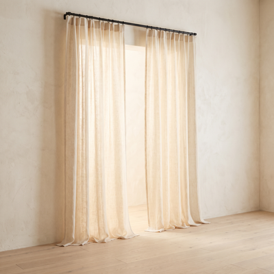 Cream flax linen sheer curtains at a window