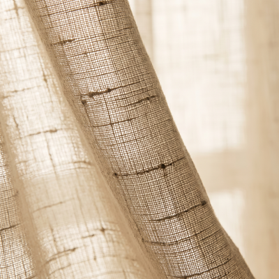 Backlit detail of the open flax weave