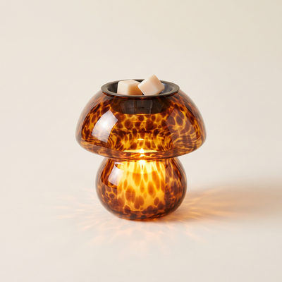 Amber glass mushroom wax melt warmer, lit