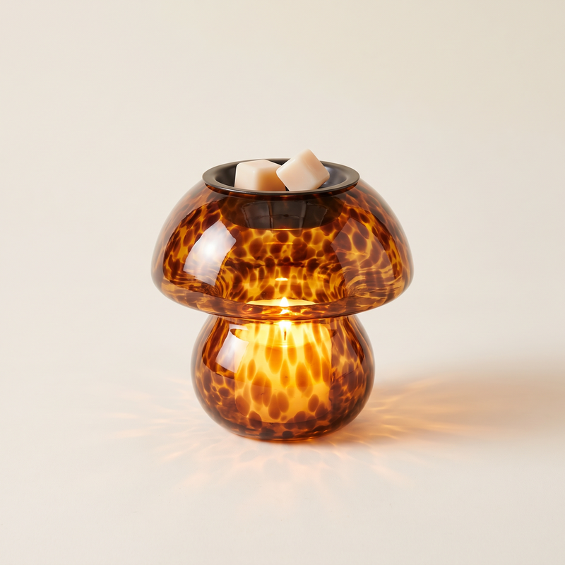 Amber glass mushroom wax melt warmer, lit