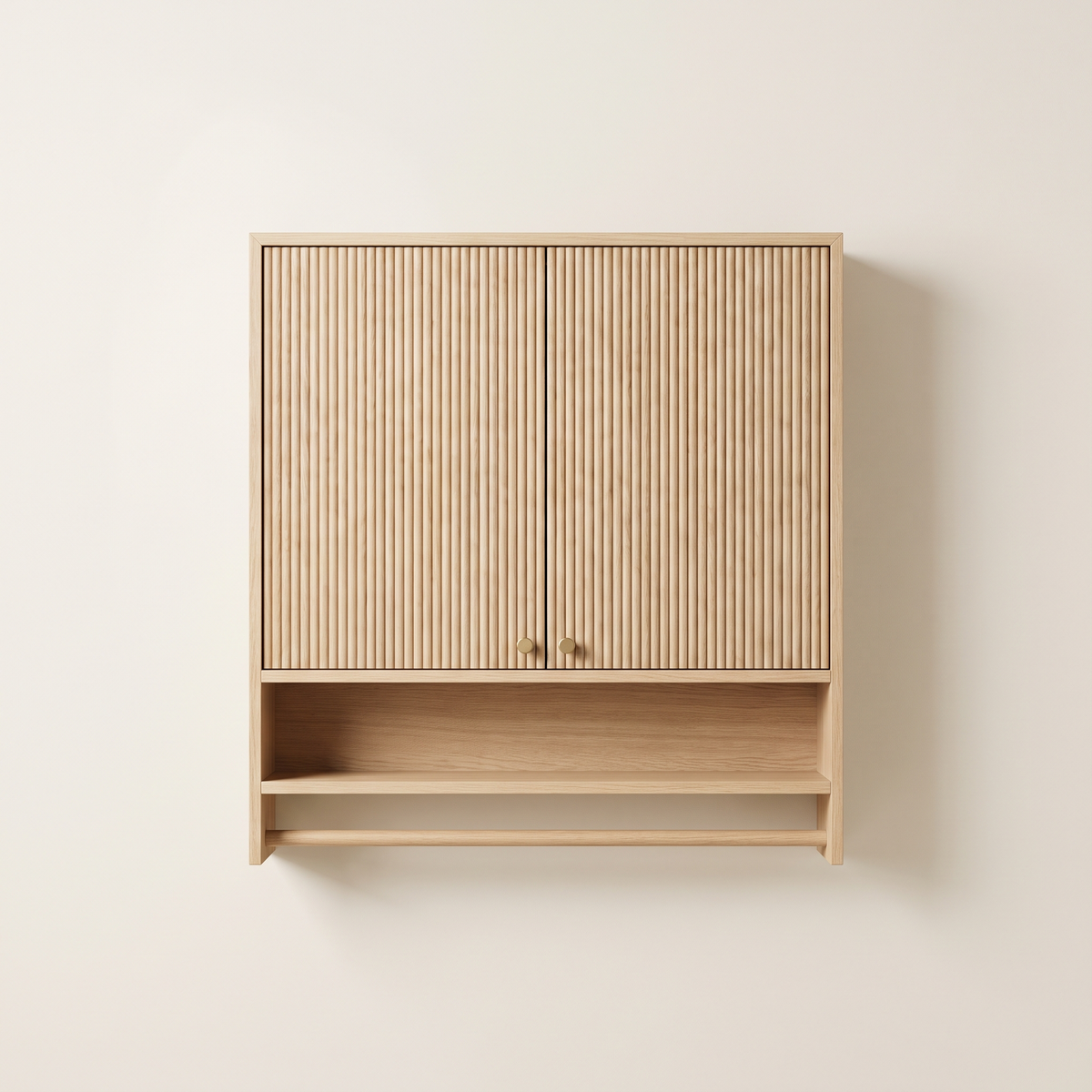 Fluted pale oak wall cabinet with brass knobs and towel rail