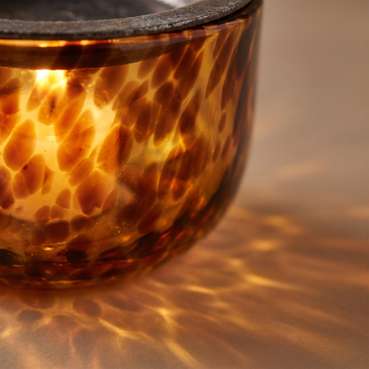 Detail of the mottled amber glass lit from within