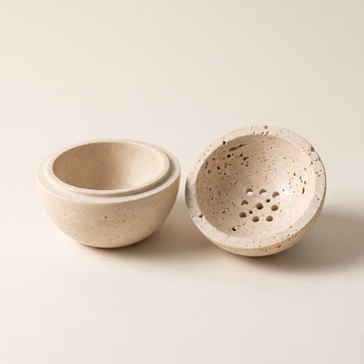 Both halves apart — the hollow well and the drilled dome