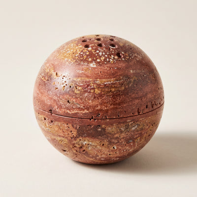The Kōdō Stone Burner in red travertine